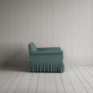 Curtain Call Love Seat in laidback linen sea teal, side profile view showing silhouette.