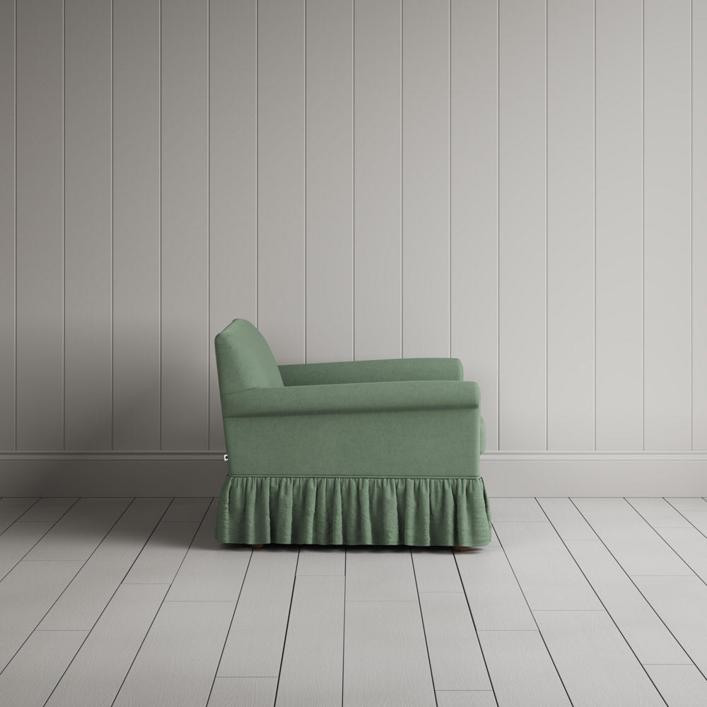  Curtain Call Love Seat in laidback linen moss, side profile view showing silhouette. 