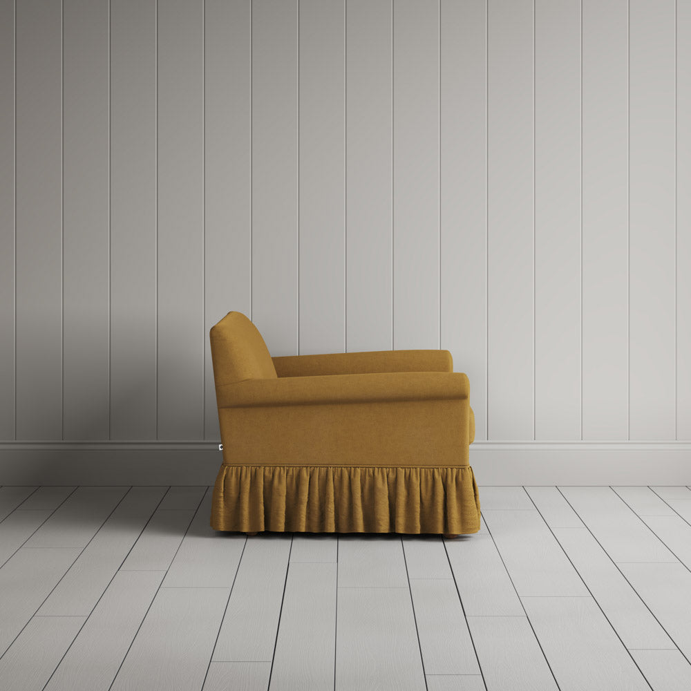  Curtain Call Love Seat in laidback linen ochre, side profile view showing silhouette. 