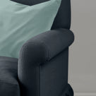 Curtain Call Love Seat styled with contrast scatter cushions in a vibrant, artistic living room setting.