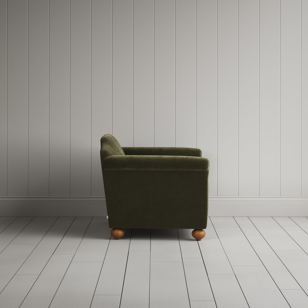 Side profile of the Caper green corduroy Dolittle love seat