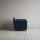 Side profile of the dark blue corduroy Dolittle love seat
