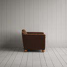 Side profile of the Tobacco corduroy Dolittle love seat