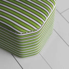 A green and white striped box, perfect for using as decorative piece.