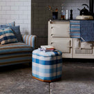 Loveseat With Cushions and Ottoman with Books Placed perfectly in the living room - NiX