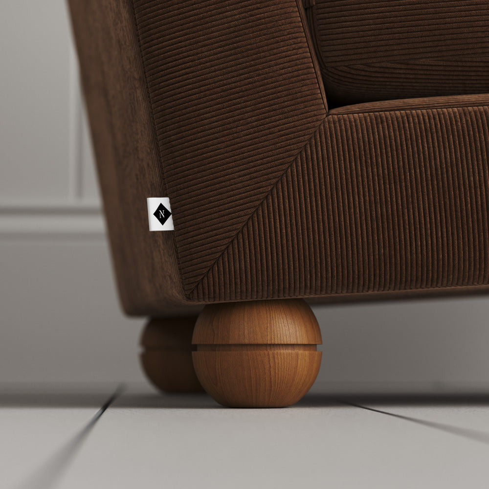  Solid timber feet closeup on the Tobacco corduroy Perch armchair. 