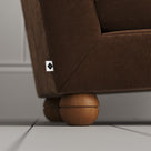 Solid timber feet closeup on the Tobacco corduroy Perch armchair.