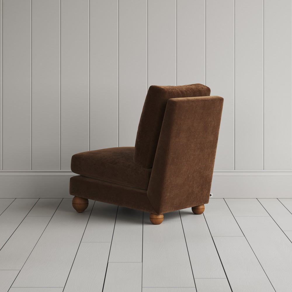  Rear profile of the Tobacco corduroy Perch armchair, showing neat proportions and UK craftsmanship. 