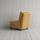 Back profile of the Perch armchair in Wheat corduroy, showing the sturdy British craftsmanship.