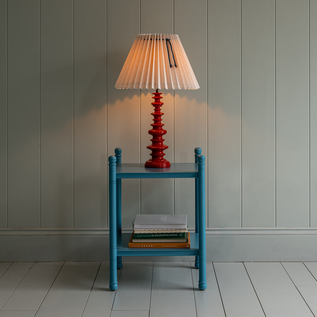 Good Turn Wooden Table Lamp Base in Berry Red With Lights 'ON'.