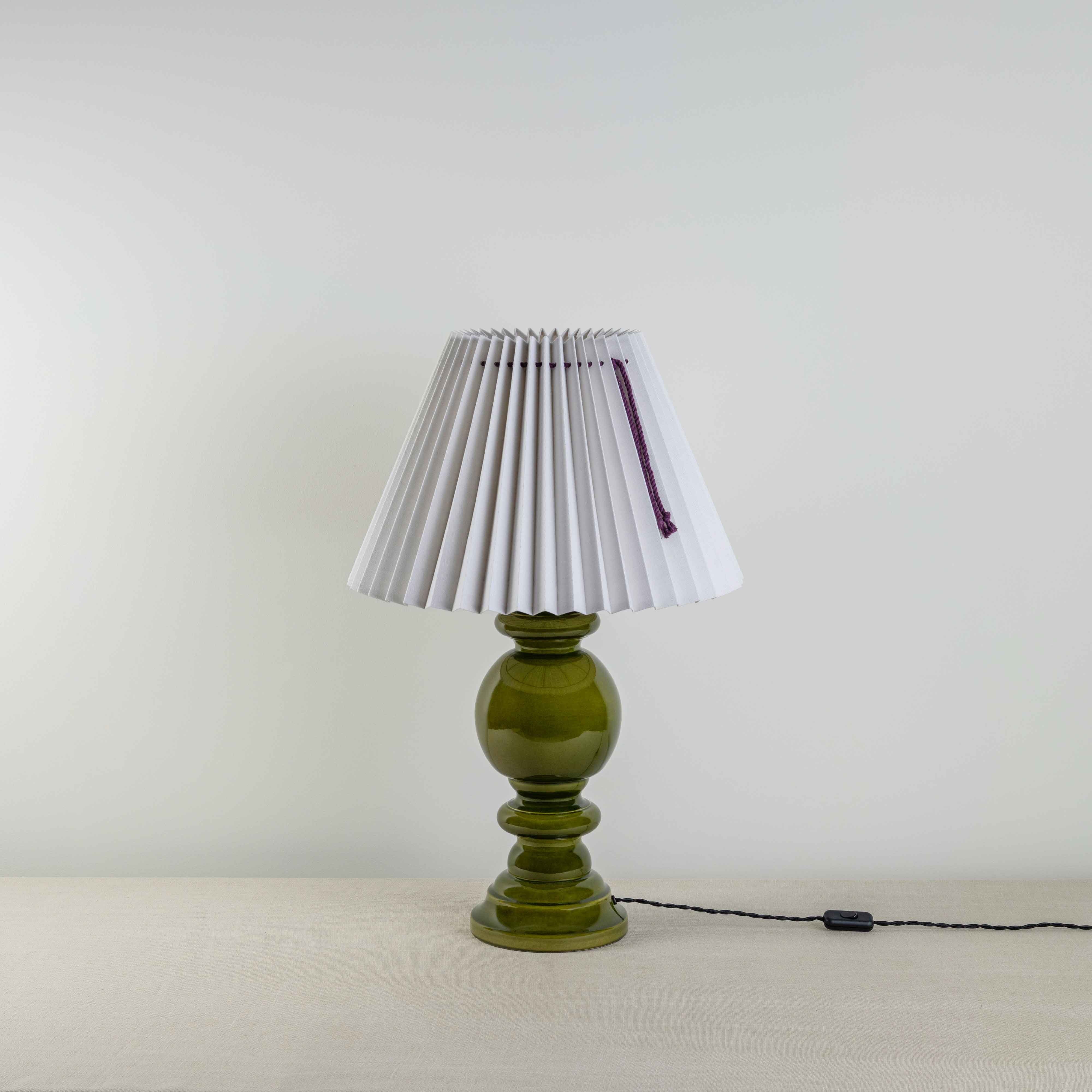  Hourglass Ceramic Table Lamp Base in Green, With Sunburst Concertina Natural Pleat Lamp Shade with Blackberry Cord - Nicola Harding 