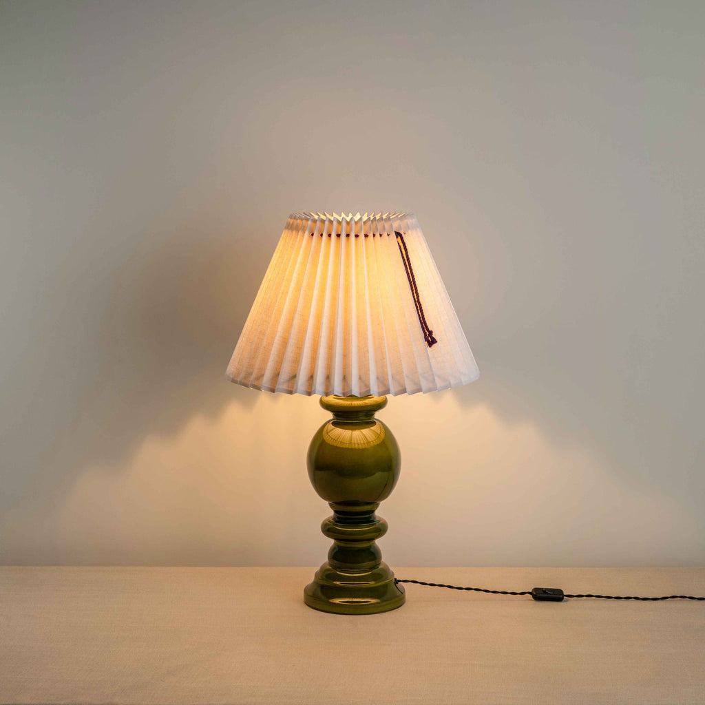  Hourglass Ceramic Table Lamp Base in Green, With Sunburst Concertina Natural Pleat Lamp Shade with Blackberry Cord With Lights 'ON' - Nicola Harding 
