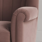 Time Out Armchair close-up detail of the rolled scroll arm and dusky pink velvet upholstery by NiX.