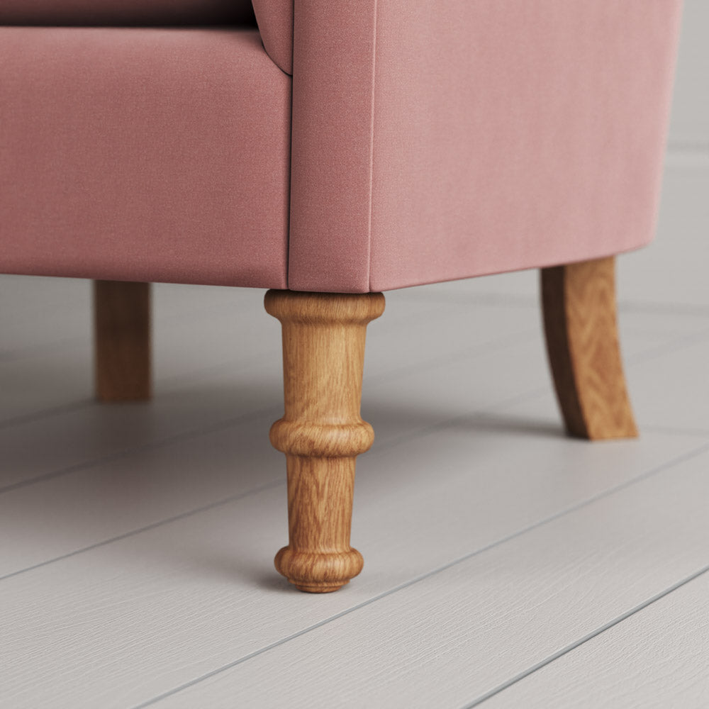  Nicola Harding design sustainable solid wood armchair foot close-up. 