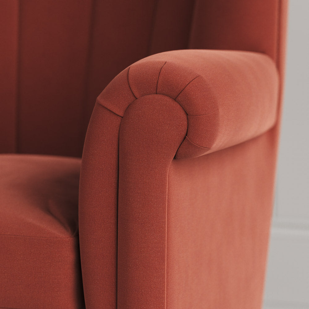 Time Out Armchair close-up detail of the rolled scroll arm and sienna velvet upholstery by NiX.