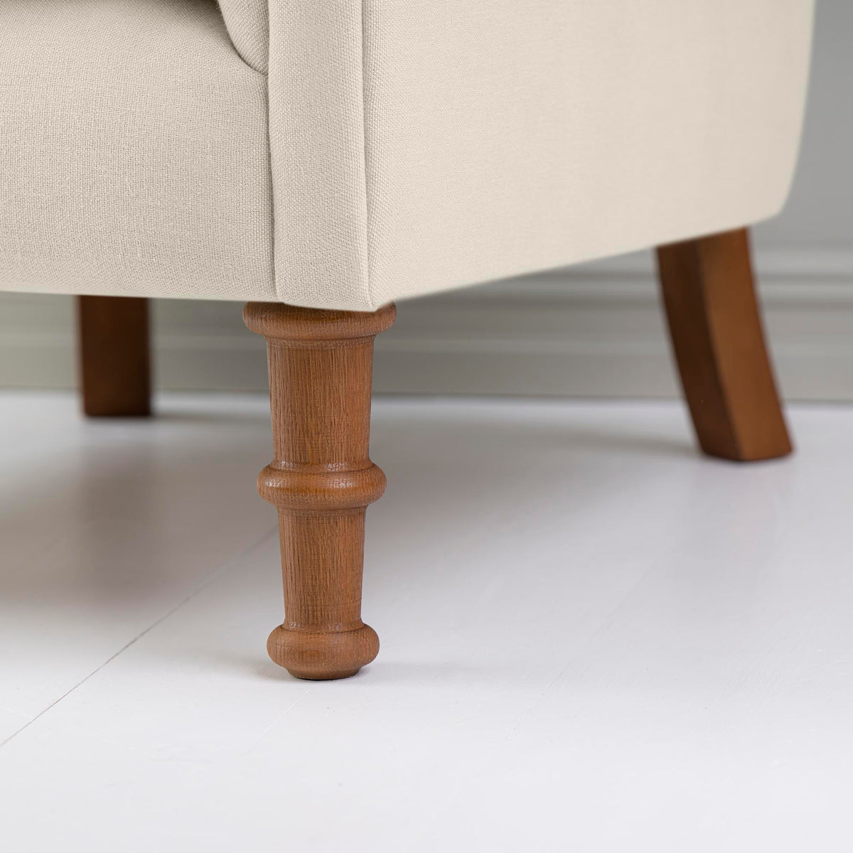 Time Out Armchair in Laidback Linen Dove, Front Foot Design Closeup - NiX