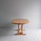 Side View of Tuck In Oval Dining Table in Oak