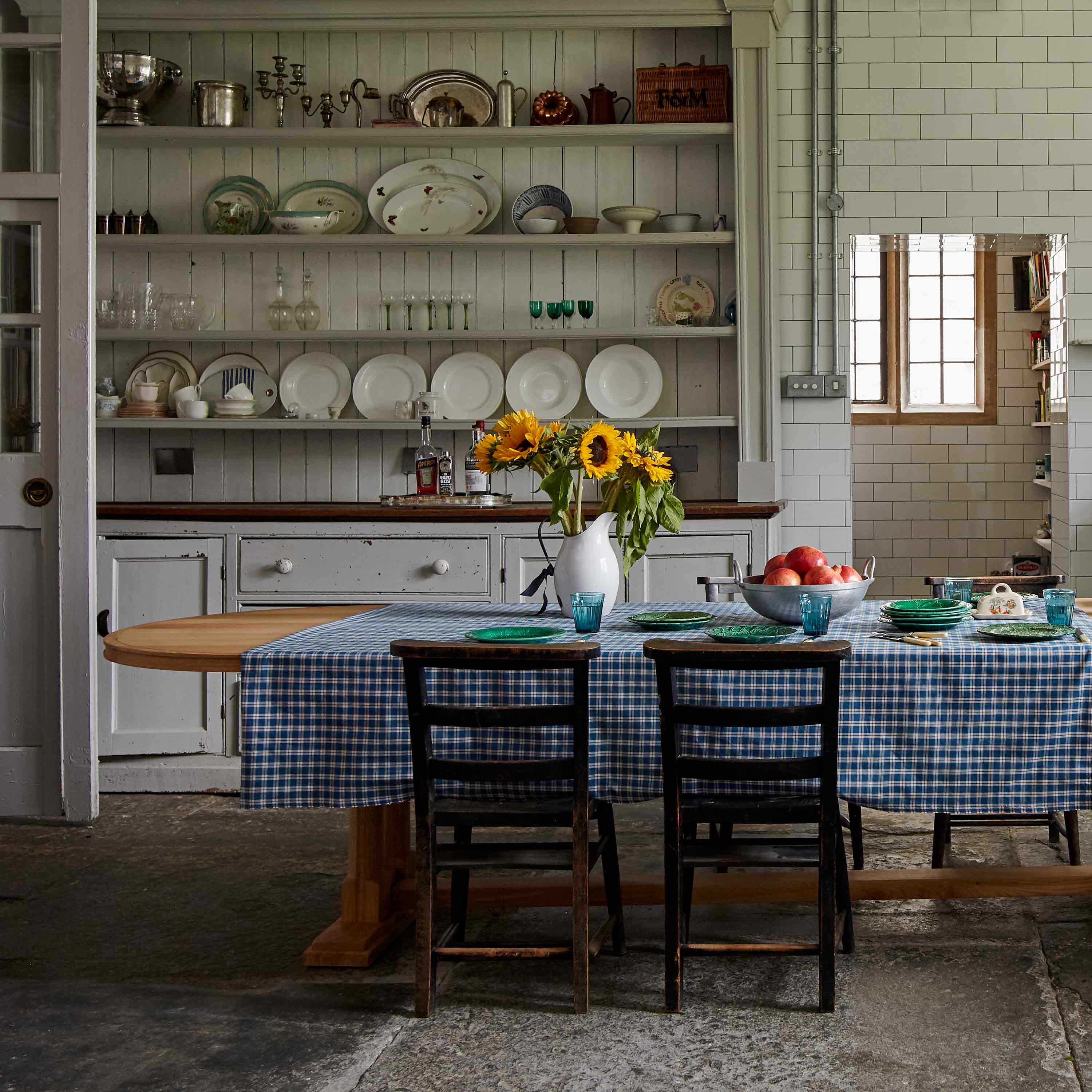  Tuck-In Oval Dining Table in Oak with Fruit Plates, Flowers, and 4 Chairs in the Kitchen – By NiX 
