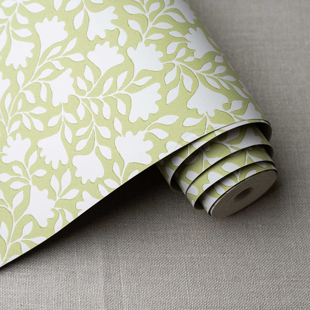  Ginkgo wallpaper in Moss Green, shown as a roll, designed by Nicola Harding. 
