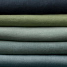 Stack of Fabrics in Multiple Colors Layered Together – By NiX